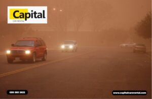 Car driving through sandstorm in Abu Dhabi